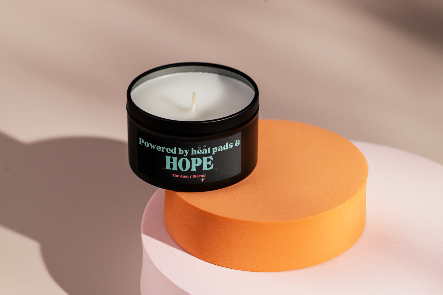 Mini 'heat pads and hope' candle