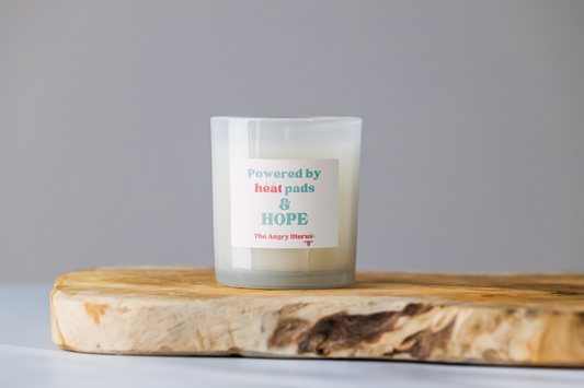 Large 'powered by heat pads and hope' candle